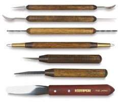 seven different types of knifes with wooden handles