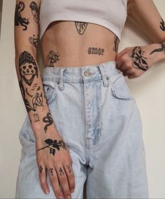 a woman with many tattoos on her arms