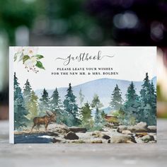 a card with an image of a moose in the woods