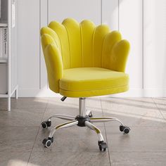 a yellow office chair sitting on top of a hard wood floor next to a white wall