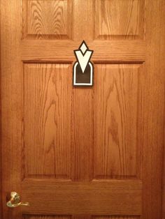 a wooden door with a sticker on it