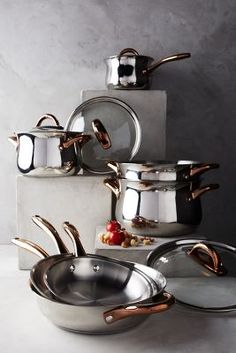 several pots and pans stacked on top of each other