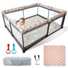 a baby in a playpen with its accessories