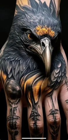 a hand with an eagle tattoo on it