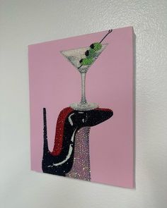 a painting of a martini glass with a dog on it