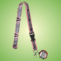 a pink lanyard with the words hello kitty on it and a badge attached to it