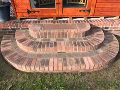 brick steps in front of a wooden building