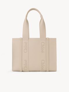 Chloé Medium Woody Tote Bag | Chloé US Calf Leather Tote Shoulder Bag With Handles, Beige Calf Leather Bag With Dust Bag, Calf Leather Shopping Bag With Double Handles, Calf Leather Tote Shoulder Bag, Calf Leather Tote Bag For Shopping, Beige Calf Leather Tote Bag, Calf Leather Tote Shoulder Bag For Shopping, Chloe Bags Handbags, Chloe Logo