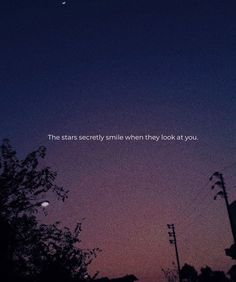 the sky is purple and blue with a quote on it that reads, the stars secretly smile when they look at you