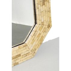 a mirror that is made out of wood and has a pattern on the bottom half