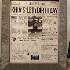 an old newspaper is displayed in front of a wall with the words kha's 16th birthday written on it