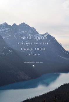 a mountain range with a lake in the foreground and an inspirational quote above it