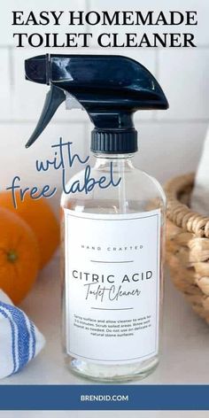 an easy homemade toilet cleaner with free label on the bottle and pumpkins in the background