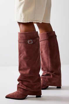 Stand out in these statement suede foldover boots, complete with flared overlays and buckle details for a pair that brings the drama. **Features:** Knee-high length, pull-on style, suede fabrication, slouchy flared overlay, buckle accent, pointed toe, chunky block heel **Why We | Felicity Foldover Boots by FP Collection at Free People in Brown, Size: US 8