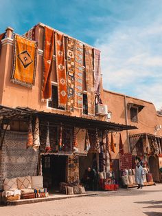 an outdoor market with lots of items on display