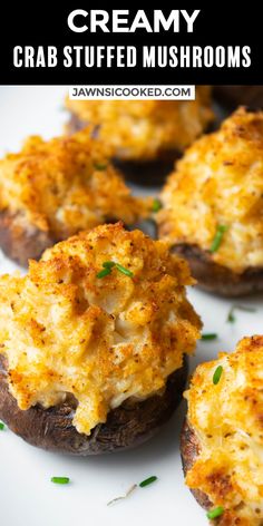 baked potatoes topped with cheese and chives on a white plate