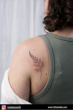 a woman with a tattoo on her shoulder