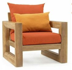 a wooden chair with orange pillows on it