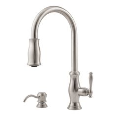 a kitchen faucet with two handles and nozzles on the side, in stainless