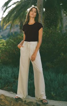 We're bringing pinstripes back this season with the casual chic Cortez Stripe Pant. Made of our breezy rayon linen fabric, this pant is perfect for all your warm weather adventures. Regular fit Yarn-Dyed Linen: 86% Rayon, 14% Linen Wide leg pant Button closure and zip fly Mid-weight woven Lined Machine Wash Cold, Hang To Dry, Warm Iron If Needed Pinstripe Pants, Dyed Linen, Wide Leg Linen Pants, Wide Leg Pant, Loungewear Sets, Pantalon Large, Denim Top, Pants Outfit, Hat Hairstyles