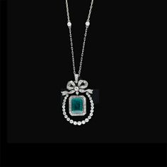 Edwardian emerald and diamond pendant necklace: Deep rich emerald cut emerald weighing approximately 3.25 carats dangles freely from a classic Edwardian set bow and inside a horseshoe shaped frame of high quality, bezel set old mine diamonds. Circa 1900. The diamond chain is relatively new. Diamond Pendant Sets, Solitaire Pendant Necklace, Sterling Necklaces, Emerald Jewelry, Diamond Pendant Necklace, Gorgeous Necklaces, Silver Diamonds, Modern Jewelry