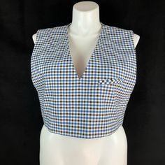 Crop Style Top Or Vest With 1 Welt Chest Pocket. Deep V-Neckline. Fully Lined. Chest Approx. 42" Length Approx. 18" 65% Polyester 32% Rayon (Viscose) 3% Elastane(Spandex) Houndstooth Blue Black Off White Retro V-neck Vest For Spring, Retro V-neck Fitted Vest, Chic Sleeveless Plaid Top, Retro V-neck Top For Workwear, V-neck Vest Top For Workwear, V-neck Vest Top For Work, Retro V-neck Vest Tops, Fall Gingham V-neck Top, Spring V-neck Retro Vest