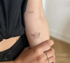 a woman with a small tattoo on her arm