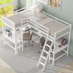 a white bunk bed sitting next to a desk with two chairs and a book shelf