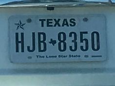 a license plate that reads, texas hjb - 8935 the lone star state