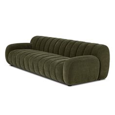 a green couch sitting on top of a white floor