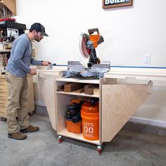 a man working on a workbench in a shop