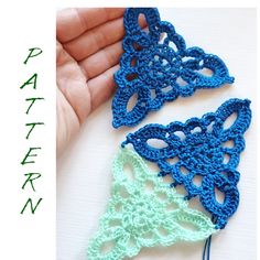 two crocheted pieces of blue and green are next to each other on a table