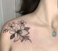 a woman's chest with flowers on it