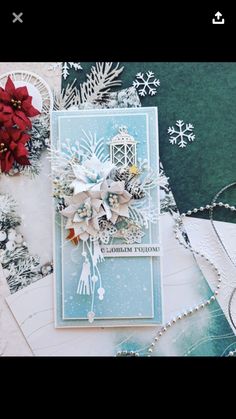 a christmas card with snowflakes and poinsettis on it, surrounded by other cards