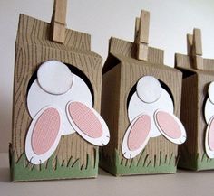 three little boxes with bunny ears on them