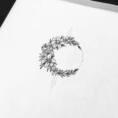 the letter c is made up of flowers and leaves on a sheet of white paper