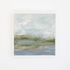 a painting hanging on the wall next to a white wall with a blue sky and clouds