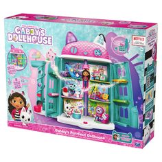 a toy dollhouse with lots of toys in the front and inside it's box