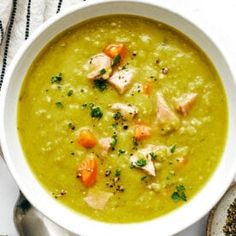 a white bowl filled with soup on top of a table