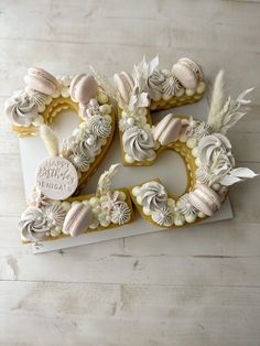 decorated cookies in the shape of numbers are arranged on top of a white card board