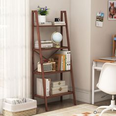 a room with a desk, bookshelf and pictures on the wall