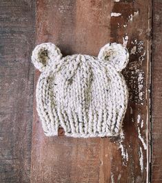 "This baby bear beanie features quality chunky wool-blend yarn and adorable crochet bear ears!  A best seller, the baby bear hat is the perfect accessory to complete your little one's outfit!  Definitely an attention grabber for your cute little baby bears at home!  Makes a great baby shower gift or cute photo prop.  NOTE: the charm of the baby bear ears is that they will not be perfectly symmetrical - this item is entirely handmade by me : )  This listing is for one Made To Order BABY through TODDLER sized hat available in five size options, see below! Please allow 1-3 business days processing time from date of order for any Made To Order item. Each item is sanitized before packaging for mailing. ---------------------------------------- ITEM DETAILS Rosemary image tag is faux leather and Crochet Bear Ears, Bear Beanie Crochet, Newborn Knit Hat, Bear Beanie, Attention Grabber, Baby Bears, Neutral Baby Gifts, Baby Fall, Baby Winter Hats