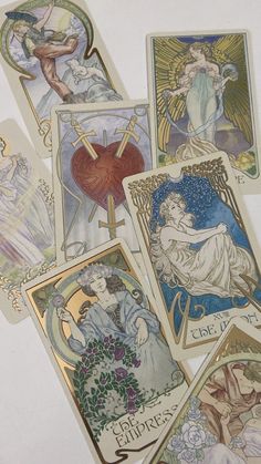 six different tarot cards with angels and hearts on them, all in various colors