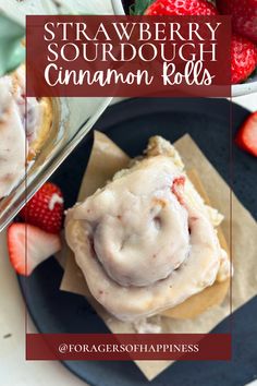 strawberry sourdough cinnamon rolls on a plate with strawberries