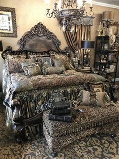 a bedroom with leopard print bedding and chandelier