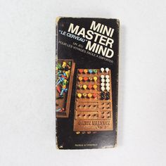 a book with an image of a board game on it's front cover and the title, mini master mind