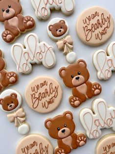 decorated cookies with teddy bears and hearts are on a white tablecloth that says, we can bearly be mine