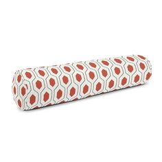 a red and white pillow with an orange pattern on the front, sitting on a white surface