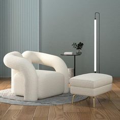 a white chair and ottoman in a room