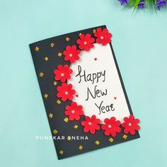 a happy new year card with red flowers